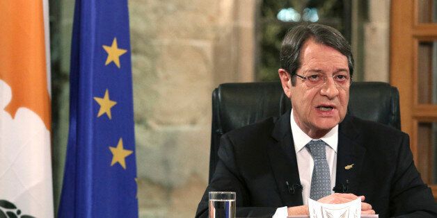 Cyprus President Nicos Anastasiades speaks during a nationally televised news conference at the Presidential Palace in Nicosia, Cyprus, Friday, Nov. 4, 2016. The president of ethnically divided Cyprus says Turkey's input will be pivotal in overcoming key obstacles preventing a reunification deal. Nicos Anastasiades, a Greek Cypriot, says he and breakaway Turkish Cypriot leader Mustafa Akinci have made significant progress on numerous issues making an envisioned federation workable. (Yiannis Kourtoglou/Pool Photo via AP)