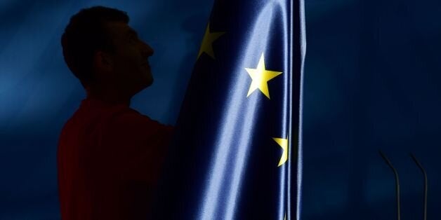 The flags, including the EU flag, are taken down after a press conference at the chancellery in Berlin, on June 27, 2016.Britain's shock decision to leave the EU forces German Chancellor Angela Merkel into the spotlight to save the bloc, but true to her reputation for prudence, she said she would act neither hastily nor nastily. / AFP / John MACDOUGALL (Photo credit should read JOHN MACDOUGALL/AFP/Getty Images)