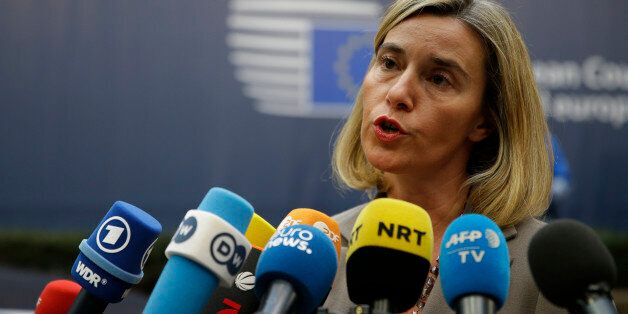 European foreign policy chief Federica Mogherini speaks to media reporters as she arrives for the EU summit in Brussels, Thursday, Oct. 20, 2016. British Prime Minister Theresa May will hold her first talks with European Union leaders and tell them that the U.K.âs decision to leave the bloc is irreversible. (AP Photo/Alastair Grant)