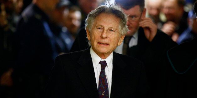 Filmmaker Roman Polanski walks on a corridor during a break of a court hearing in Krakow February 25, 2015. Polanski testified at a hearing in Poland on Wednesday regarding a U.S. request for his extradition over a 1977 child sex crime conviction, though the court said it needed more time to make a decision. REUTERS/Kacper Pempel (POLAND - Tags: CRIME LAW ENTERTAINMENT)