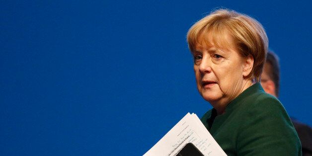 German Chancellor and leader of the conservative Christian Democratic Union party CDU Angela Merkel leaves the CDU party convention in Essen, Germany, December 7, 2016. REUTERS/Kai Pfaffenbach