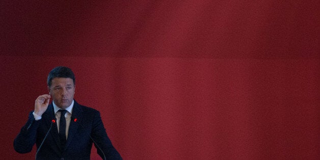 Matteo Renzi, Italy's prime minister, gestures while speaking during the Italian carmakers association conference at Fiat Chrysler Automobiles NV's Alfa Romeo assembly plant in Cassino, Italy, on Thursday, Nov. 24, 2016. Renzis party would seek early elections in Italy by the summer of 2017 if he loses a referendum on constitutional reform, according to a senior official. Photographer: Matthew Lloyd/Bloomberg via Getty Images