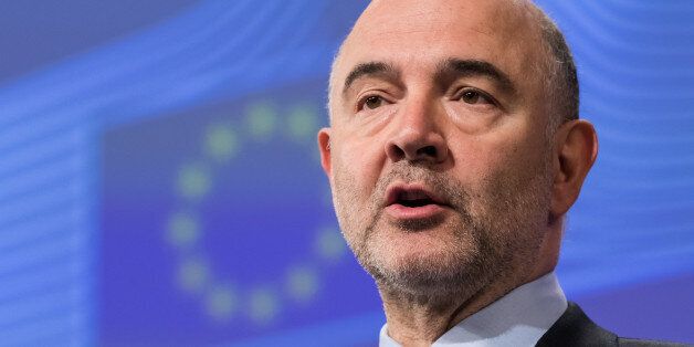 European Commissioner for Economic and Financial Affairs Pierre Moscovici addresses the media at EU headquarters in Brussels on Wednesday July 27, 2016. The European Union's executive has refrained from calling for heavy fines against Spain and Portugal over budgetary breaches over the past years and sought to set