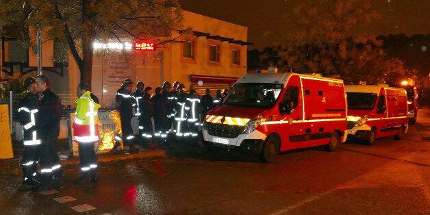 Firefighters and ambulances are seen in the village of Montferrier-sur-Lez, southern France, Friday, Nov. 25, 2016. The French gendarmerie says a masked gunman has burst into a retirement home for monks in southern France and killed an elderly woman with a knife. The press service for the national military police couldn't immediately say whether the incident is linked to a terror act or not. (AP Photo)