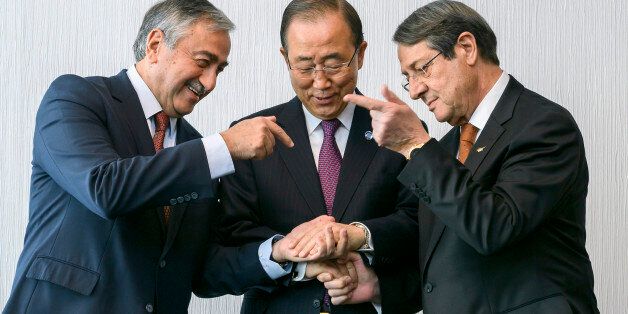 U.N. Secretary-General Ban Ki-moon (C) pose for photographers with Turkish Cypriot leader Mustafa Akinci (L) and Cypriot President Nicos Anastasiades during the Cyprus reunification talks in the Swiss mountain resort of Mont Pelerin, Switzerland November 7, 2016. REUTERS/Fabrice Coffrini/Pool