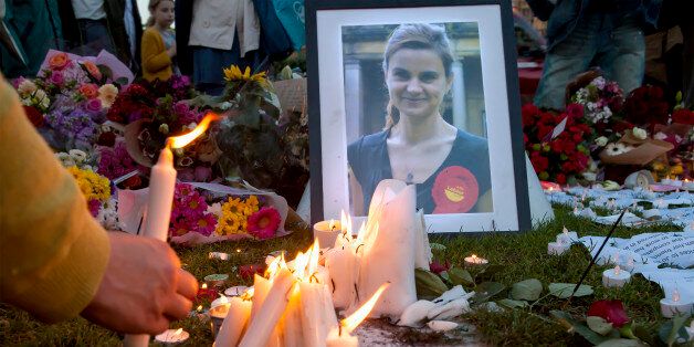 London, United Kingdom - June 17, 2016: Jo Cox's Vigil. A candlelit vigil was held in Parliament Square for the murdered MP, Jo Cox. People lit candles, left flowers, wrote messages and mourned.
