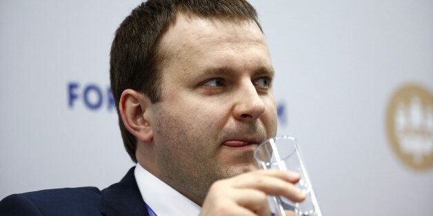 Maxim Oreshkin, Russia's deputy finance minister, takes a drink during a panel session on day two of the St. Petersburg International Economic Forum 2016 (SPIEF) in Saint Petersburg, Russia, on Friday, June 17, 2016. The 20th anniversary St. Petersburg International Economic Forum which brings together heads of state and governments, political leaders, leading experts and global company executives runs from June 16-18. Photographer: Simon Dawson/Bloomberg via Getty Images