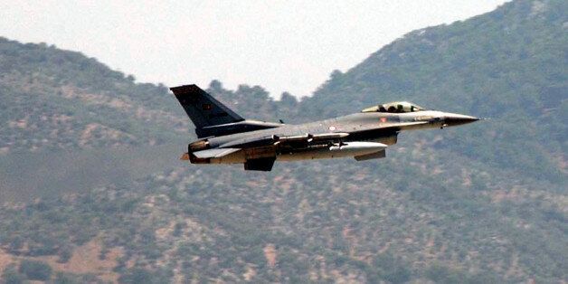 A Turkish Air Force F-16 fighter jet flies over a military airbase in Dalaman near the southwestern Turkish city of Mugla, Tuesday, May 23, 2006. A Greek and a Turkish warplane collided Tuesday over the Aegean Sea island of Karpathos as they shadowed each other. The Turkish pilot was rescued by a merchant ship, while a Greek helicopter and navy vessels searched for the Greek pilot after the two F-16 jets crashed into the sea 20 kilometers, 12.5 miles, south of Karpathos. (AP Photo/Anatolia, Kenan Gurbuz) ** TURKEY OUT **