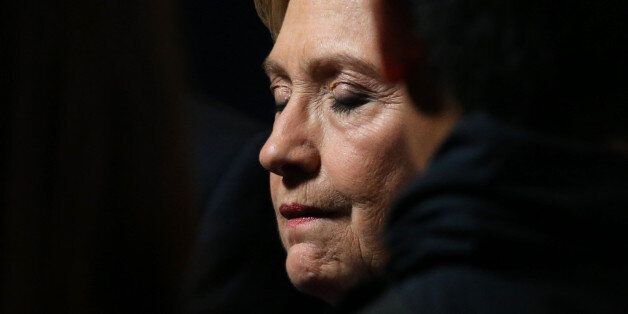 Hillary Clinton closes her eyes as she greets members of her staff and supporters after speaking about the results of the U.S. election at a hotel in the Manhattan borough of New York, U.S., November 9, 2016. REUTERS/Carlos Barria