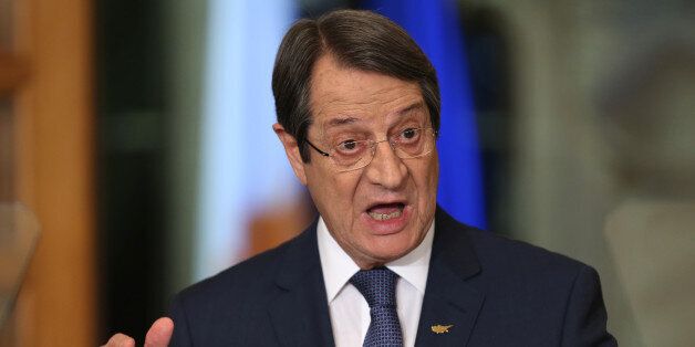 Cyprus President Nicos Anastasiades speaks during a nationally televised news conference at the presidential palace in Nicosia on November 23, 2016. Crunch negotiations on ending the decades-old division of Cyprus broke down with its rival leaders still far apart and no date set for a new round of UN-brokered talks. It was the second round of intensive meetings this month between Greek Cypriot leader Nicos Anastasiades and his Turkish Cypriot counterpart Mustafa Akinci. / AFP / POOL / Petros Karadjias (Photo credit should read PETROS KARADJIAS/AFP/Getty Images)
