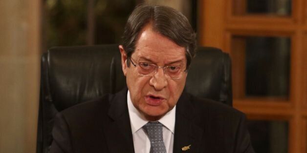 Cypriot President Nicos Anastasiades talks during a televised press conference at the Presidential Palace in Nicosia on November 4, 2016, ahead of a five-day summit in Geneva aimed at reunifying the Mediterranean island.UN chief Ban Ki-moon is to open a five-day summit in Geneva on November 7 between Turkish Cypriot leader Mustafa Akinci and his Greek Cypriot counterpart Anastasiades for talks billed as the last best chance for an enduring peace deal. / AFP / POOL / YIANNIS KOURTOGLOU (Ph