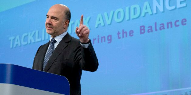 European Commissioner for Economic and Financial Affairs Pierre Moscovici speaks during a media conference at EU headquarters in Brussels on Thursday, Jan. 28, 2016. The European Union has unveiled new measures to combat tax evasion by big companies as part of efforts to end sweet deals between member countries and multinationals. (AP Photo/Virginia Mayo)