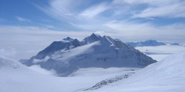 This photo was taken from below the summit of Antarctica's highest peak, Mount Vinson. The Pyramid shaped mountain is Mount Shinn. The Mountain Behind is Mount Tyree.