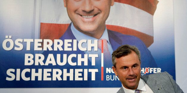Austrian presidential candidate Norbert Hofer of the Freedom Party (FPOe) arrives for a news conference ahead of a re-run of the run-off presidential election in Vienna, Austria August 29, 2016. Poster reads