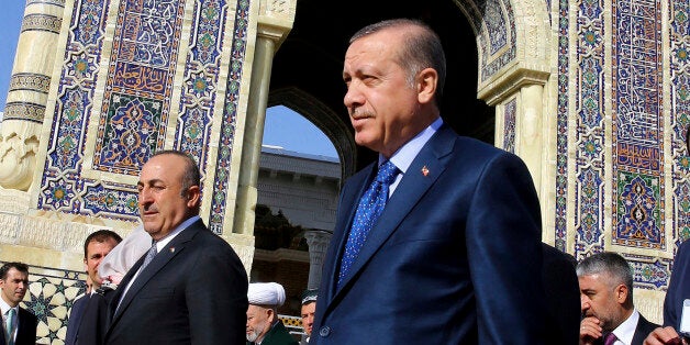 Turkey's President Recep Tayyip Erdogan, front, visit the mausoleum of Imam Bukhari, one of most respected Islamic scholars and intellectuals by Sunni Muslims, in Samarkand, Uzbekistan, Friday, Nov. 18, 2016. Erdogan is in Uzbekistan for a one-day official visit. (Kayhan Ozer, Presidential Press Service, Pool photo via AP)