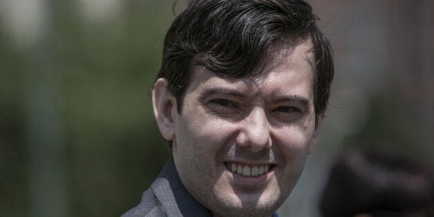 Martin Shkreli, former chief executive officer for Turing Pharmaceuticals AG, leaves Federal Court in Brooklyn, New York, U.S, on Thursday, July 14, 2016. A federal judge scheduled the former pharmaceutical executive to be tried on June 26, 2017, in a securities fraud case. Photographer: Victor J. Blue/Bloomberg via Getty Images