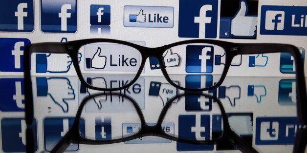 ST PETERSBURG, RUSSIA - NOVEMBER 16, 2016: Glasses on a reflective surface in front of a computer screen showing Facebook logos. Sergei Konkov/TASS (Photo by Sergei Konkov\TASS via Getty Images)