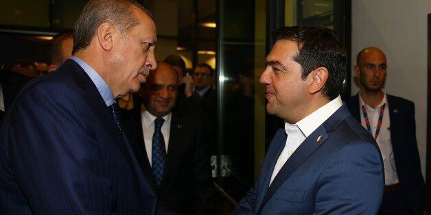 WARSAW, POLAND - JULY 9: President of Turkey Recep Tayyip Erdogan speaks with Prime Minister of Greece Alexis Tsipras (R) in Warsaw, Poland on July 9, 2016. (Photo by Kayhan Ozer/Anadolu Agency/Getty Images)