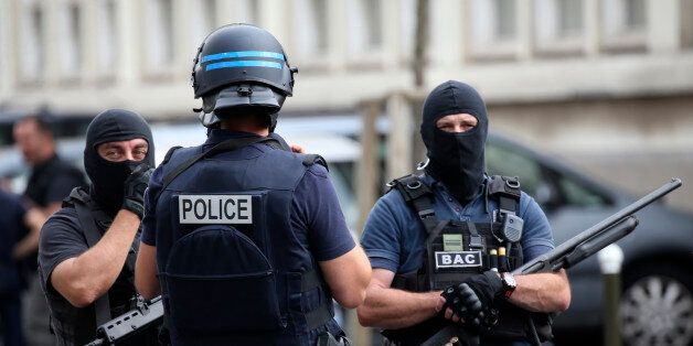 French police and anti-crime brigade (BAC) secure a street they carried out a counter-terrorism swoop at different locations in Argenteuil, a suburb north of Paris, France, July 21, 2016. REUTERS/Charles Platiau