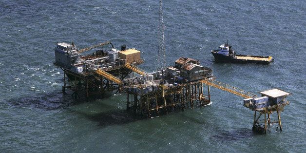 Rescue crew surrounds an oil platform operated by Houston-based Black Elk Energy which exploded off the coast of Louisiana in the Gulf of Mexico, in this November 16, 2012 file photo. REUTERS/Sean Gardner/Files