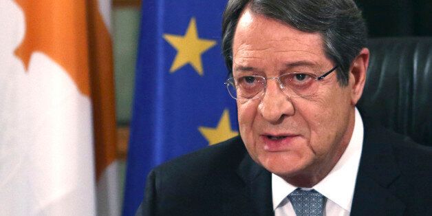 Cyprus President Nicos Anastasiades speaks during a nationally televised news conference at the Presidential Palace in Nicosia, Cyprus, Friday, Nov. 4, 2016. The president of ethnically divided Cyprus says Turkey's input will be pivotal in overcoming key obstacles preventing a reunification deal. Nicos Anastasiades, a Greek Cypriot, says he and breakaway Turkish Cypriot leader Mustafa Akinci have made significant progress on numerous issues making an envisioned federation workable. (Yiannis Kourtoglou, Pool Photo via AP)