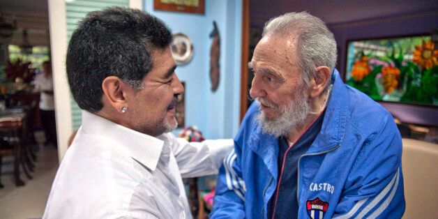 Cuba's Fidel Castro shakes hands with former soccer star Diego Maradona in Havana, Cuba, Saturday, April 13, 2013. . (AP Photo/Alex Castro)