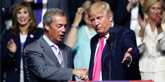 FILE - This is a Wednesday, Aug. 24, 2016 file photo of Republican presidential candidate Donald Trump, right, welcomes pro-Brexit British politician Nigel Farage, to speak at a campaign rally in Jackson, Miss. Britain's vote to leave the European Union was a major shock to the global political system. But in a year of political earthquakes, it has just been trumped. Like Brexit, Donald Trump's victory over Hillary Clinton in the U.S. presidential election was driven by voters turning against established order and mainstream politicians. (AP Photo/Gerald Herbert, File)