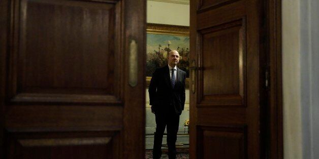 European Commissioner for Economic and Financial Affairs Pierre Moscovici stands before a meeting with the Greek Prime Minister in Athens, on Tuesday, Nov. 3, 2015. Moscovici's talks with officials in Greece's leftwing government will focus on the progress of reforms demanded by the country's European creditors in return for a third multi-billion euro bailout. (AP Photo/Petros Giannakouris)