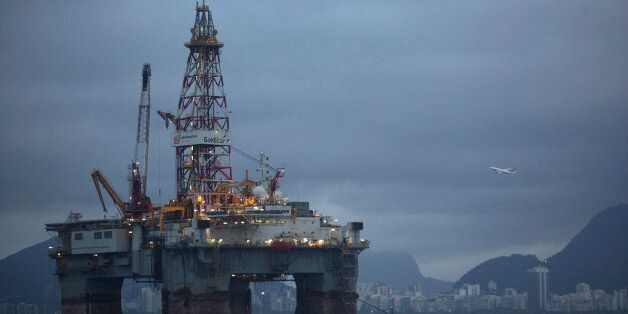 An oil platform is seen in the waters of the Guanabara bay in Niteroi, Brazil, Tuesday, April 21, 2015. Brazil's state-run oil company Petrobras says it lost $2.1 billion because of inflated contracts and other costs related to a long-running kickback scheme. Federal prosecutors have called the scheme the biggest corruption case ever uncovered in Brazil. They stress that they are still investigating and says the scope of the case continues to widen. (AP Photo/Leo Correa)