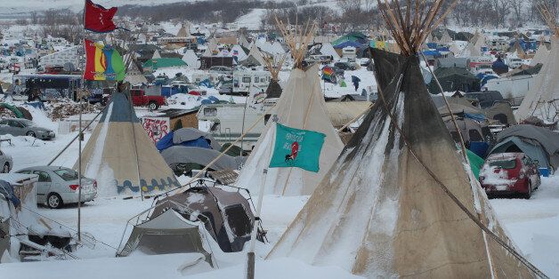 CANNON BALL, ND - NOVEMBER 30: Snow covers Oceti Sakowin Camp near the Standing Rock Sioux Reservation on November 30, 2016 outside Cannon Ball, North Dakota. Native Americans and activists from around the country have been gathering at the camp for several months trying to halt the construction of the Dakota Access Pipeline. The proposed 1,172 mile long pipeline would transport oil from the North Dakota Bakken region through South Dakota, Iowa and into Illinois. (Photo by Scott Olson/Getty I