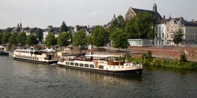 Tourist boats on the river Maas or Meuse, Maastricht, Limburg province, Netherlands