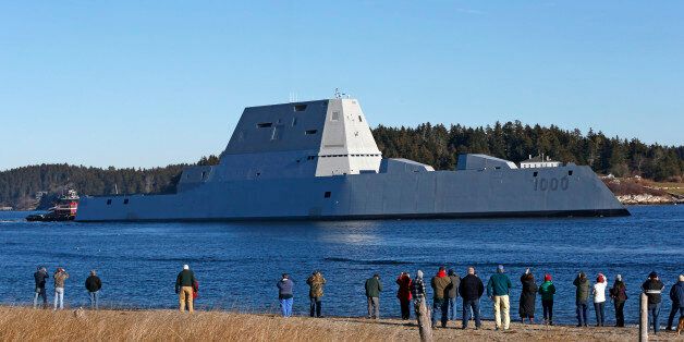 FILE- In this Dec. 7, 2015, file photo, the USS Zumwalt travels down the Kennebec River in Phippsburg, Maine. The GPS-guided, rocket-powered ammunition developed for the new 155mm Advanced Gun System currently costs nearly as much as a cruise missile, making them too expensive for the Navy to buy in large quantities for the stealthy destroyer, according to officials. (AP Photo/Robert F. Bukaty, File)