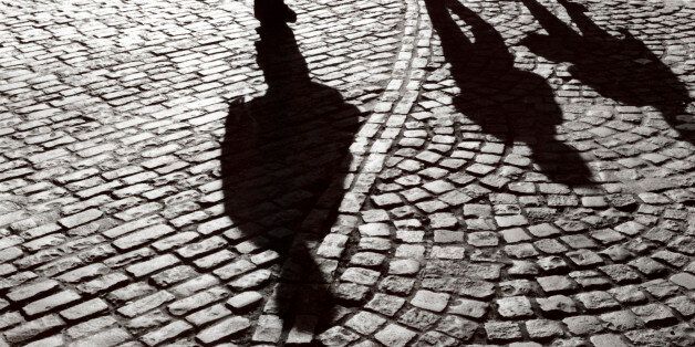 Shadows of people on cobbled street (Photo by Universal Images Group via Getty Images)