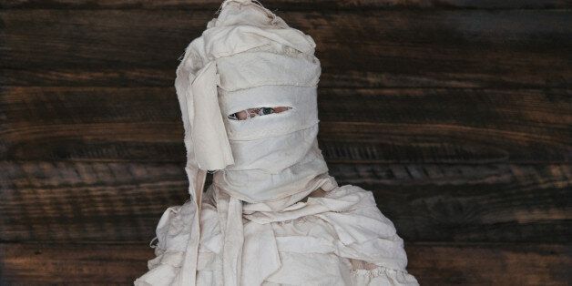 Child dressed in home made egyptian mummy costume
