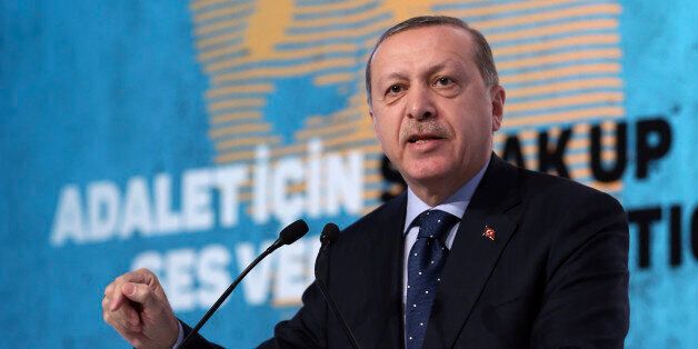 Turkey's President Recep Tayyip Erdogan addresses a meeting about