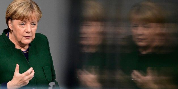 German Chancellor Angela Merkel gestures as she gives a speech during a session at the Bundestag (lower house of parliament) on November 23, 2016 in Berlin.Merkel addressed the parliament on key domestic and foreign issues during a week of budget debate. / AFP / TOBIAS SCHWARZ (Photo credit should read TOBIAS SCHWARZ/AFP/Getty Images)