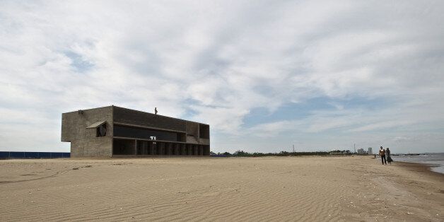 QINHUANGDAO, CHINA - MAY 12: (CHINA OUT) General view of a public benefit library located at the north part of International Sandboarding Center in Beidaihe's New District on May 13, 2015 in Qinhuangdao, Hebei province of China. A free library opened on May 1 (Workers' Day) at the seaside of Beidaihe New District and has attracted visitors to read here thanks to its original designs and quiet atmosphere. The library is made from concrete and wood and deeply 'rooted' in coastal beach. The boundless sea outside the library and the quiet space in the library make it China's 'Loneliest' library. (Photo by VCG/VCG via Getty Images)