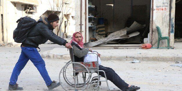 ALEPPO, SYRIA - NOVEMBER 29: Residents escape Assad regime bombardment in Al Moyaser neighbourhood of Aleppo, Syria on November 29, 2016. (Photo by Jawad al Rifai/Anadolu Agency/Getty Images)