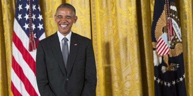 US President Barack Obama laughs while presenting the 2015 National Medal of Arts and 2015 National Humanities Medals during a ceremony in the East Room of the White House in Washington, DC, September 22, 2016. / AFP / SAUL LOEB (Photo credit should read SAUL LOEB/AFP/Getty Images)