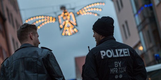 NUREMBERG, GERMANY - NOVEMBER 25: Police stand guard at the 2016 Nuremberg Christmas Market on its opening day on November 25, 2016 in Nuremberg, Germany. German authorities are on high alert over the possibility of terrorist attacks following arrests and raids in recent months against terror suspects, several of whom had entered Germany posing as Syrian refugees. Christmas markets are opening across Germany this week in a tradition that dates back centuries. For the next four weeks the Christmas markets, which are usually located on the main square of the hosting town or village, will provide holiday cheer with mulled wine, sausages, Christmas ornaments and other delights. (Photo by Lennart Preiss/Getty Images,)