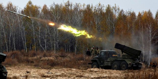Ukrainian servicemen fire BM-21 Grad multiple rocket launcher systems during military exercises near the village of Divychky in Kyiv region, Ukraine, October 28, 2016 (Photo by Maxym Marusenko/NurPhoto via Getty Images)