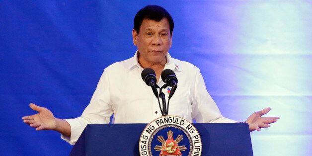 Philippine President Rodrigo Duterte gestures as he attends the 80th anniversary of the National Bureau of Investigation in Manila, Philippines on Monday, Nov. 14, 2016. (AP Photo/Aaron Favila)