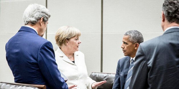 HANGZHOU, CHINA - SEPTEMBER 5: In this handout photo provided by the German Government Press Office (BPA), German chancellor Angela Merkel speaks with US President Barack Obama (L) and US Secretary of State John Kerry (L) on the sidelines of the G20 meeting on September 5, 2016 in Hangzhou, China. World leaders are gathering for the 11th G20 Summit from September 4-5. (Photo by Jesco Denzel/Bundesregierung via Getty Images)