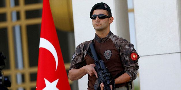 FILE PHOTO - A Turkish special forces police officer guards the entrance of the Presidential Palace in Ankara, Turkey, August 5, 2016. REUTERS/Umit Bektas/File Photo