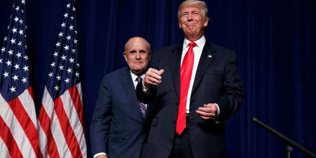 Republican presidential candidate Donald Trump, right, stands with former New York Mayor Rudy Giuliani during a campaign rally, Tuesday, Sept. 6, 2016, in Greenville, N.C. (AP Photo/Evan Vucci)