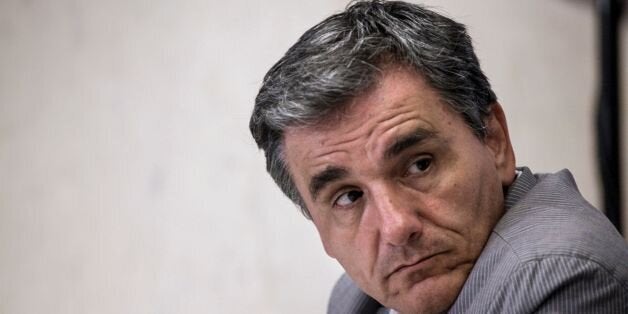 Greece's Finance Minister Euclid Tsakalotos looks on during a joint statement to the press with European Commissioner for Economic and Financial Affairs Pierre Moscovici (Unseen) at the EU representation office in Athens on July 18, 2016. / AFP / Kostis Ntantamis (Photo credit should read KOSTIS NTANTAMIS/AFP/Getty Images)