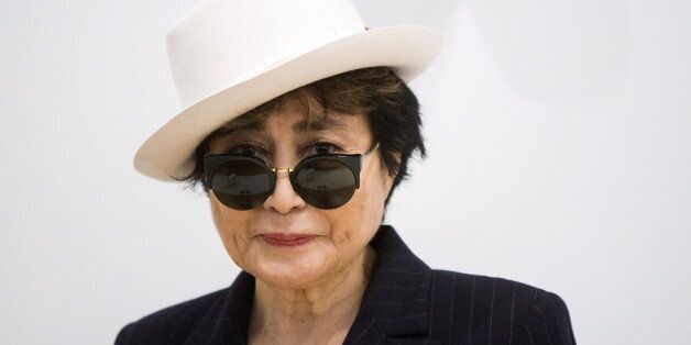 Artist Yoko Ono she stands in the exhibit