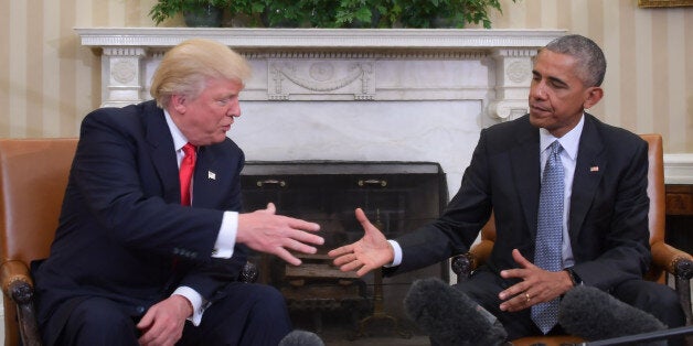 TOPSHOT - US President Barack Obama and Republican President-elect Donald Trump shake hands during a transition planning meeting in the Oval Office at the White House on November 10, 2016 in Washington,DC. / AFP / JIM WATSON (Photo credit should read JIM WATSON/AFP/Getty Images)