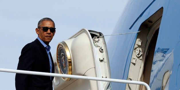 President Barack Obama boards Air Force One in Andrews Air Force Base, Md., Sunday, Nov. 6, 2016, en route to Florida, where he will speak at a campaign event for Democratic presidential candidate Hillary Clinton at Osceola County Stadium. (AP Photo/Carolyn Kaster)