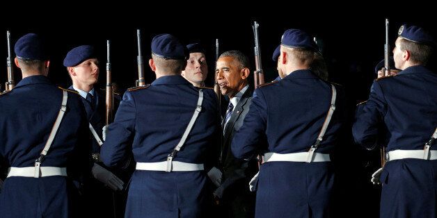 On the second leg of his last foreign trip, U.S. President Barack Obama reviews an honor guard upon his arrival on Air Force One in Berlin, Germany November 16, 2016. REUTERS/Kevin Lamarque